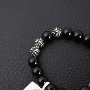 Chrome Hearts Silver Bead Obsidian Bracelet featuring black obsidian beads and distinctive silver bead accents on a textured black background.