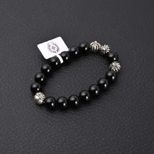 Chrome Hearts Silver Bead Obsidian Bracelet featuring black obsidian beads and silver accents, presented on a textured black surface.