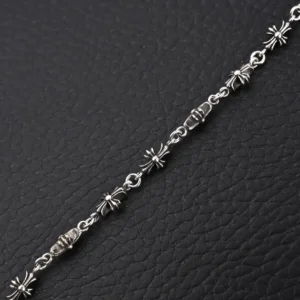 Chrome Hearts Diamond Free Fine Cross Flower Bracelet on textured black background, featuring intricate flower designs and a polished silver finish, suitable for both men and women.