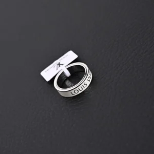 Louis Vuitton LV x Nigo co-branded enamel ring with engraved logo on a black background, showcasing luxury replica jewelry.