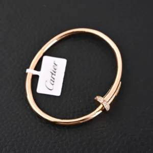 Cartier Juste un Clou bracelet rose gold with diamond pav&eacute; accent luxury accessory