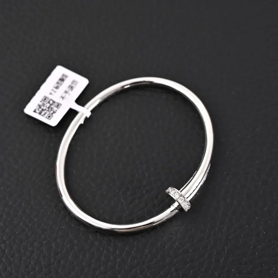 Cartier Love bracelet silver metal with diamond accent ring accessory