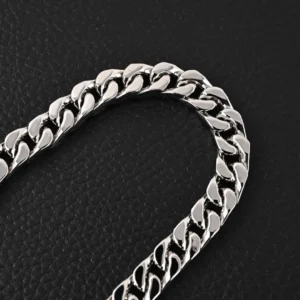 Louis Vuitton Black Enamel Cuban Silver Necklace featuring a sleek titanium steel chain with polished links, set against a dark background, emphasizing luxury and modern design.