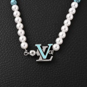Louis Vuitton LV Turquoise Logo Letter Metal bracelet featuring turquoise and pearl beads, showcasing luxury design and cultural significance.