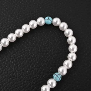Turquoise and pearl necklace featuring turquoise beads and a sophisticated design, inspired by the Louis Vuitton LV Turquoise Logo Letter Metal bracelet.