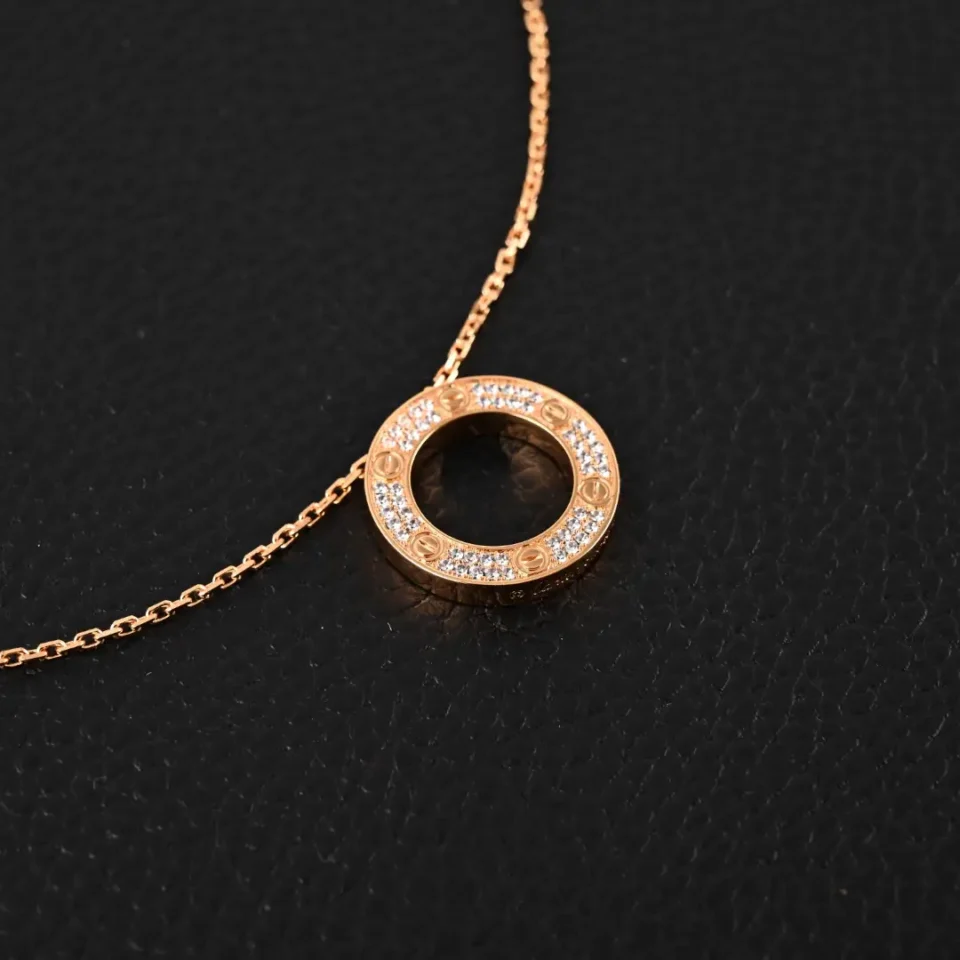 Cartier Love necklace rose gold with diamond-studded circle pendant on chain accessory