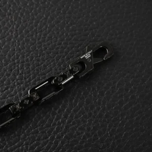 Black titanium steel chain link with engraved Louis Vuitton logo, featured as part of the LV Monogram black quenched bamboo necklace replica.
