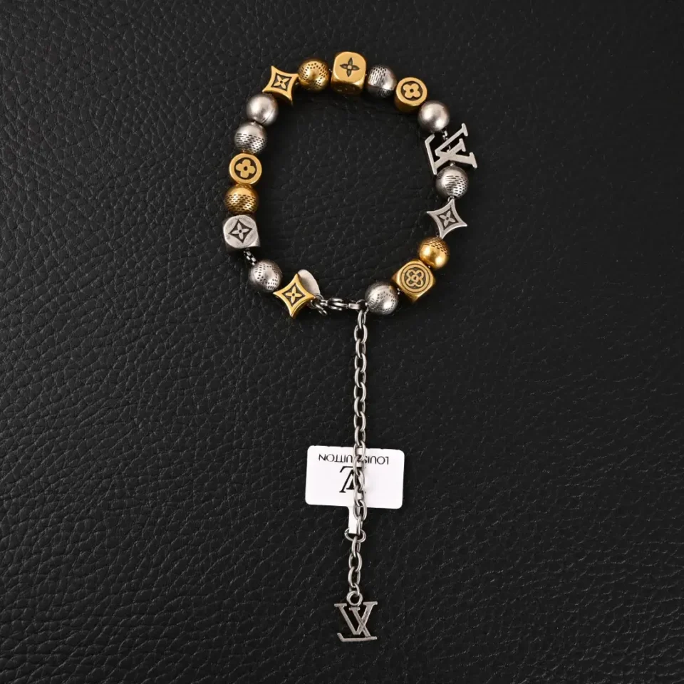 Louis Vuitton beaded bracelet gold silver-tone metal with LV logo charm and chain detail accessory