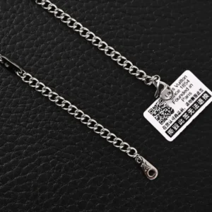 Louis Vuitton Damier Rings necklace featuring a lustrous brass chain with engraved LV letters and Damier patterns, showcasing luxury accessory design.