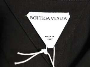 Bottega Veneta clothing label white fabric black garment made in Italy tag