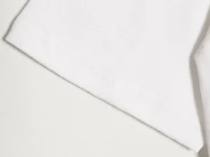 Repsgoat white cotton t-shirt close-up of fabric and hem stitching detail