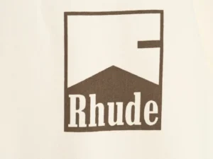 Rhude retro logo print on cream T-shirt, showcasing brand identity for RHUDE 25ss collection.