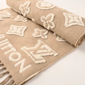 Louis Vuitton 3D Embossed Logo Wool Tassel Long Scarf featuring a beige background with embossed logo patterns and tassels, emphasizing luxury fashion accessory appeal.