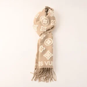 Louis Vuitton 3D Embossed Logo Wool Tassel Long Scarf in beige, featuring iconic logo patterns and tassels, ideal luxury accessory for stylish outfits.
