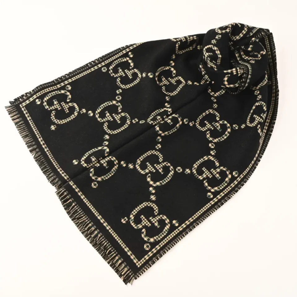 Gucci scarf black wool beige GG logo pattern fringed edges luxury accessory