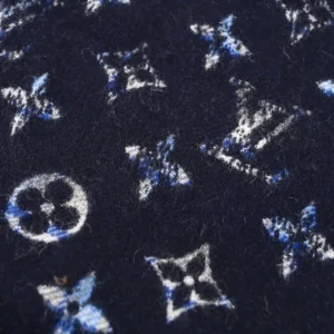 Louis Vuitton fabric navy blue wool material with white and blue monogram pattern close-up