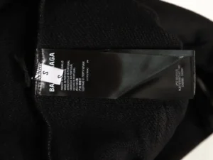 Balenciaga clothing tag black fabric label made in Portugal with care instructions in multiple languages