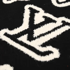 Louis Vuitton wool sweater black white jacquard logo patch knitted fabric close-up