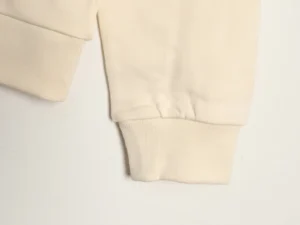 Louis Vuitton hoodie sleeve detail showcasing ribbed cuff and premium fabric quality.