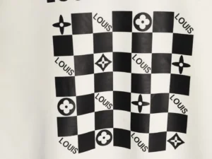 Louis Vuitton checkerboard pattern black and white canvas material with brand name and floral motifs