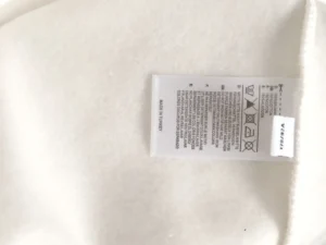 No usable brand, product type, model number, color, or material visible on the tag for SEO-optimized alt text.