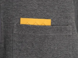No brand visible gray fabric pocket with a small yellow card or item partially inserted