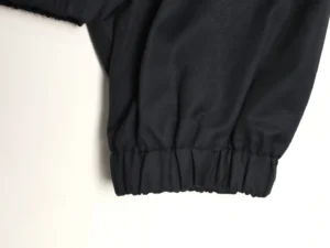 No brand or model information visible on black elastic cuff fabric accessory