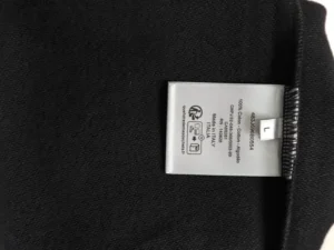 Label tag for DIOR letter embroidered round neck sweatshirt, featuring fabric composition details and size information.