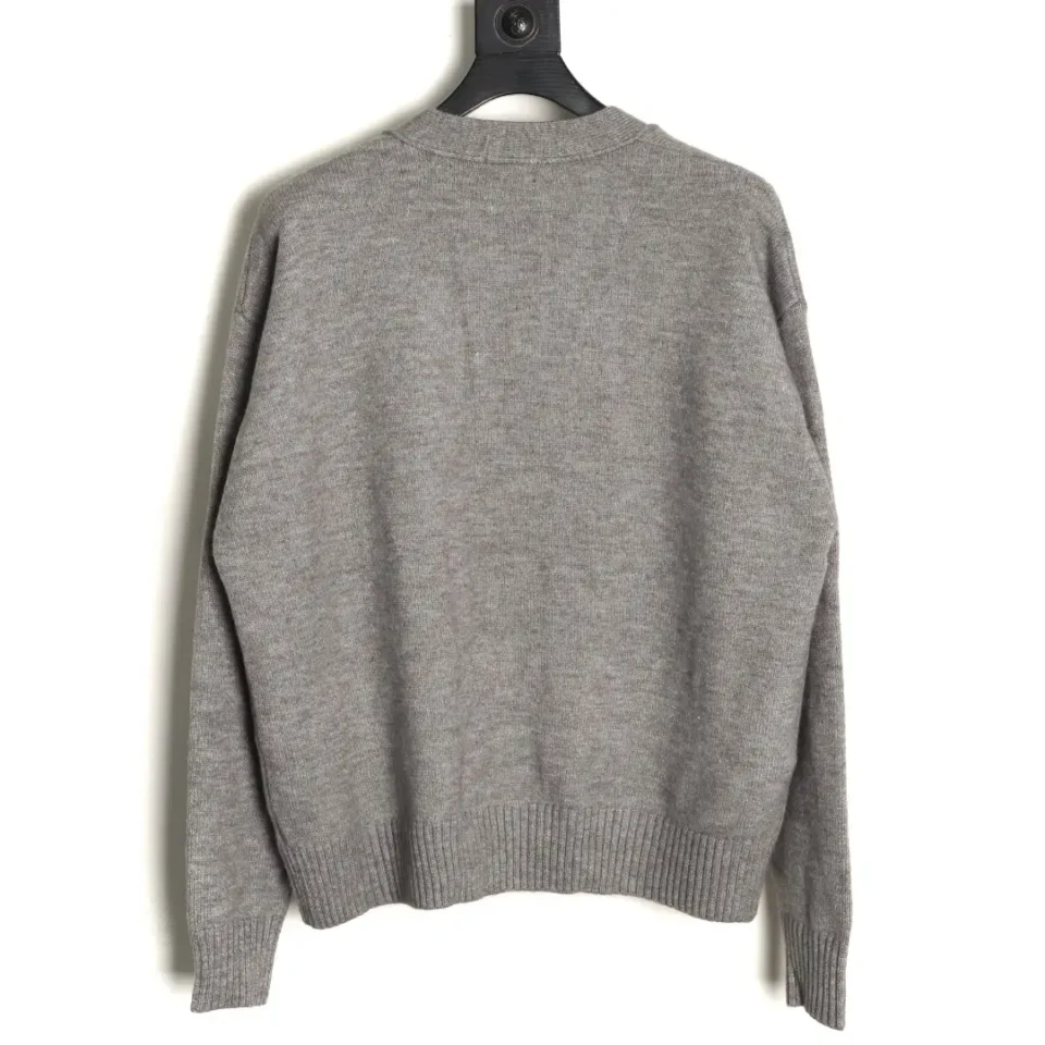 The image shows the back of a plain grey sweater on a hanger. However, there is no visible branding, model number, or material information. Please provide the brand, model, and material details for the sweater so I can generate the SEO-optimized alt text for you.