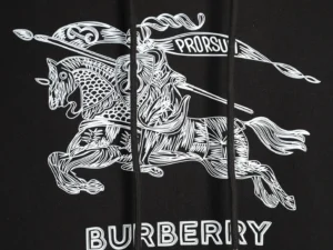 Burberry Sketch War Horse hoodie featuring a detailed white graphic of a knight on horseback with a banner, against a black background, emphasizing designer style and quality.