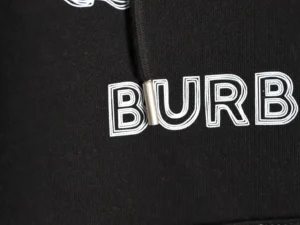 Burberry logo detail on a black hoodie from the Sketch War Horse collection, showcasing premium fabric and oversized style.