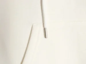 Repsgoat hoodie cream white cotton fabric with metal-tipped drawstring and kangaroo pocket stitching close-up