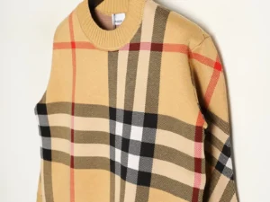 Burberry plaid patchwork stripes knitted sweater showcasing multiple color blocks in a stylish design, highlighting its quality craftsmanship and premium materials.