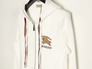 Burberry plaid warhorse hoodie featuring iconic checkered design, high-density stitching, and durable zippers, displayed on a hanger.