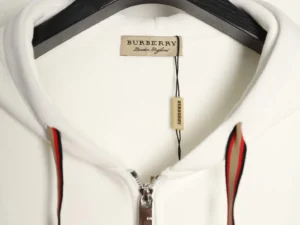 Burberry plaid warhorse hoodie featuring high-density stitching, durable zippers, and iconic branding on a hanger.