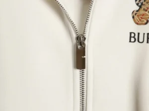 Burberry plaid warhorse hoodie featuring a durable zipper and embroidered logo detail, highlighting high-quality craftsmanship and design elements.