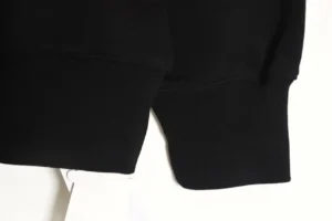 Repsgoat black hoodie cotton fabric ribbed cuffs close-up detail