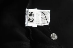 Chrome Hearts clothing black fabric care tag with black and white branded hang tag accessory
