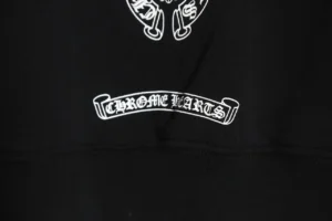 Chrome Hearts hoodie featuring FW Rainbow logo and embroidered brand name in white on a black background.
