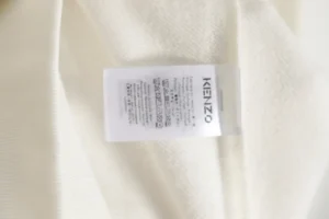 Kenzo clothing white cotton fabric care label with washing instructions