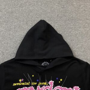 SP5DER P*NK V2 Hoodie in black featuring a hood and colorful graphic text design, highlighting its trendy streetwear style.