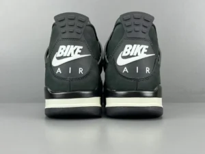 Black Jordan 4 RM SP Nigel Sylvester sneakers featuring "BIKE AIR" branding on the heel, highlighting stylish design elements.