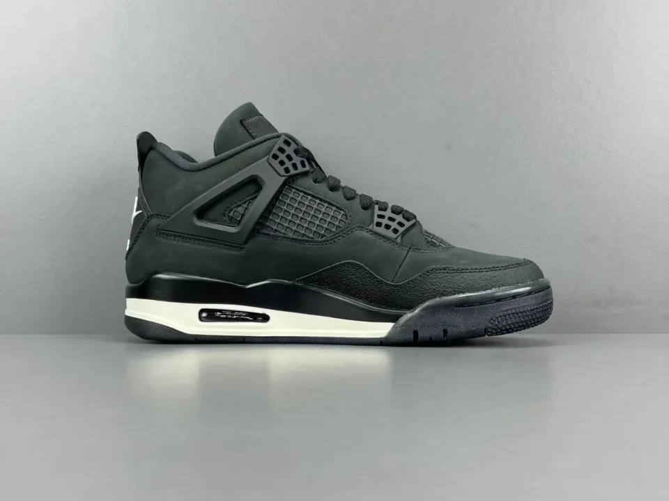 Air Jordan 4 Retro black colorway nubuck and mesh sneakers with white midsole accents