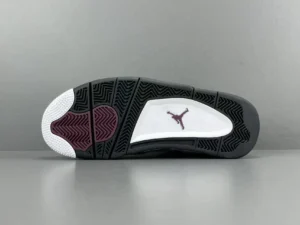 Air Jordan 4 Retro PSG sneaker sole featuring black and white design with purple accents and iconic Jumpman logo, showcasing the collaboration with Paris Saint-Germain.