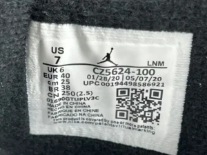 Jordan 4 Retro PSG sneaker label showing size, model number, and QR code for product identification.
