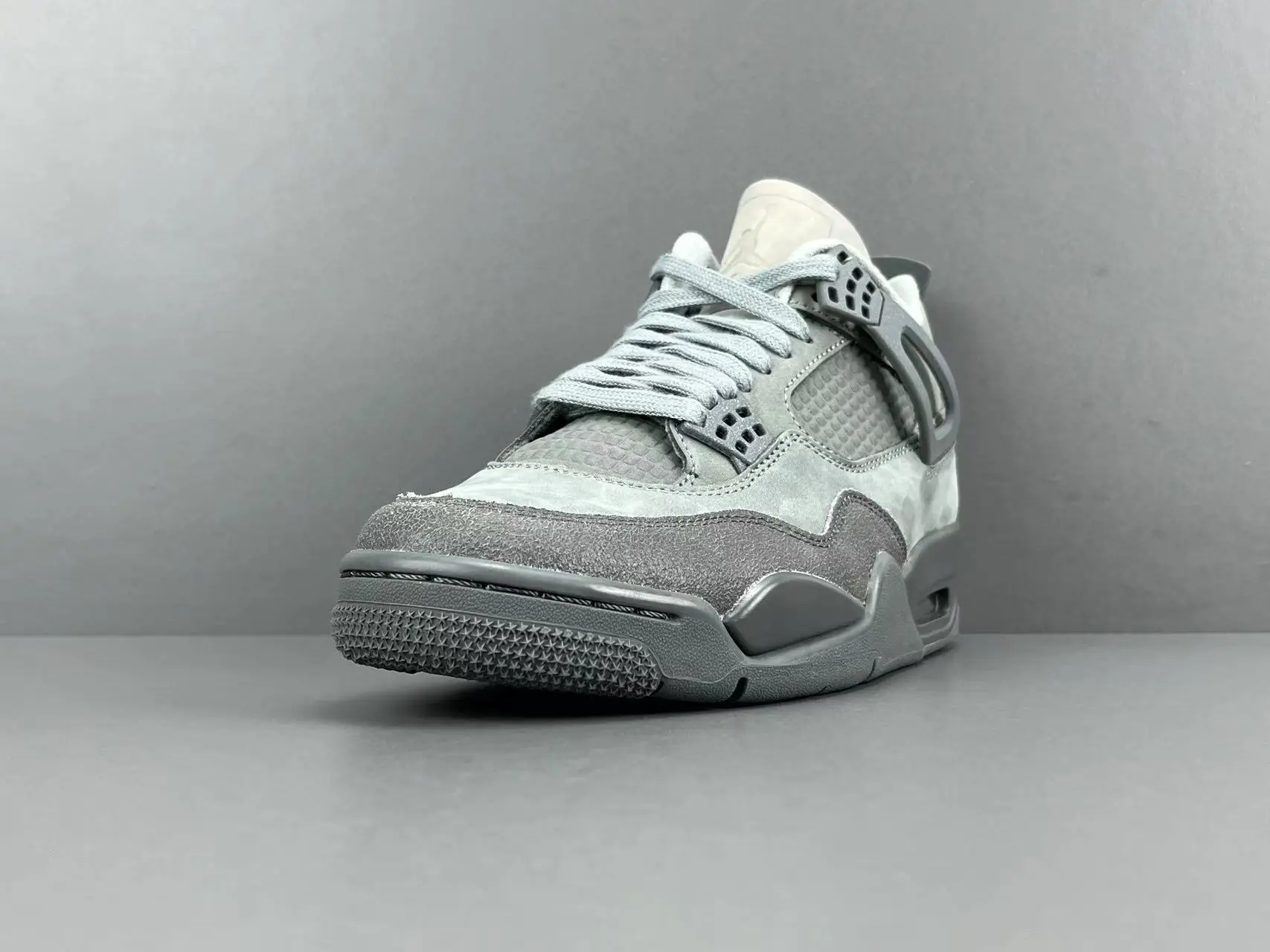 Air Jordan 4 Retro Cool Grey grey suede leather sneakers with mesh paneling and rubber sole