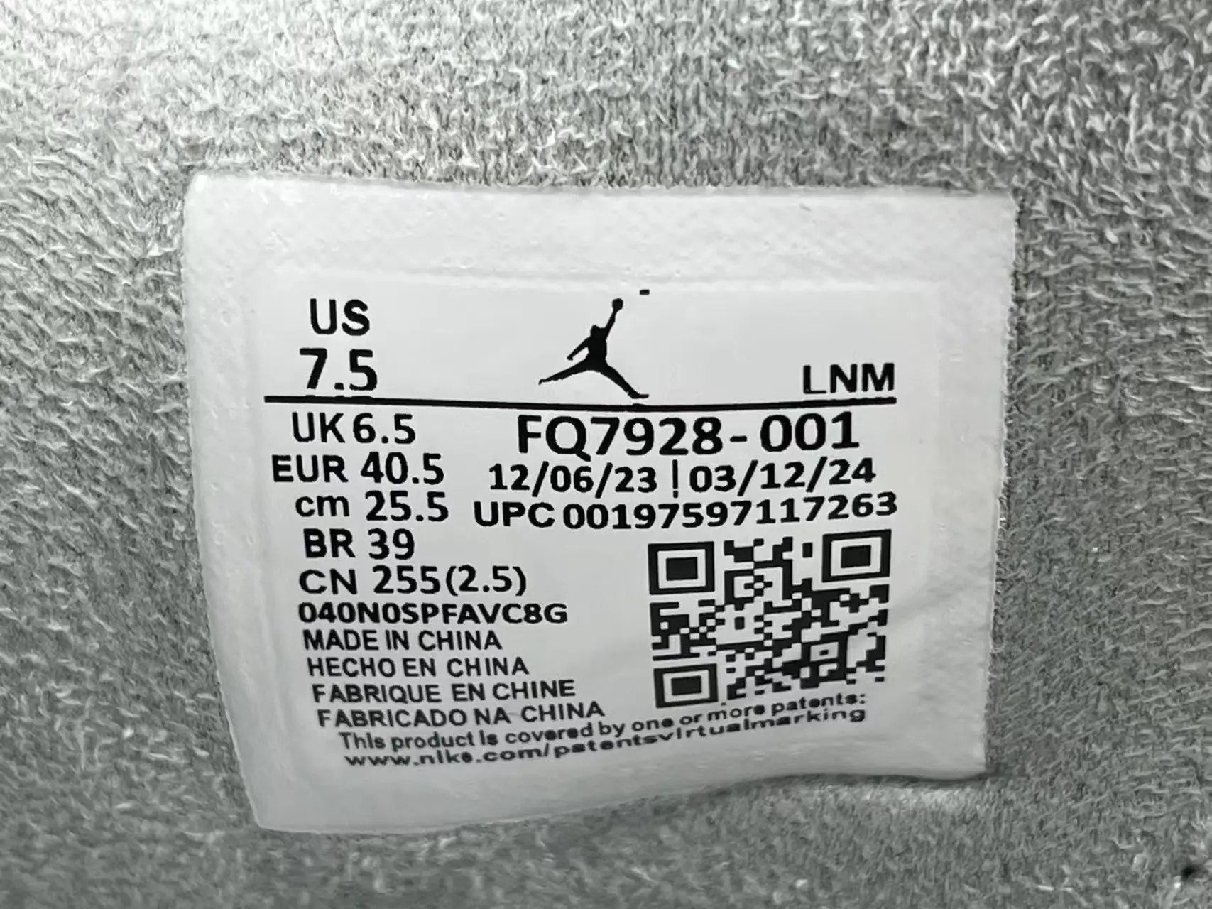 Nike Air Jordan 1 Low FQ7928-001 black colorway textile sneakers label size 7.5 US made in China