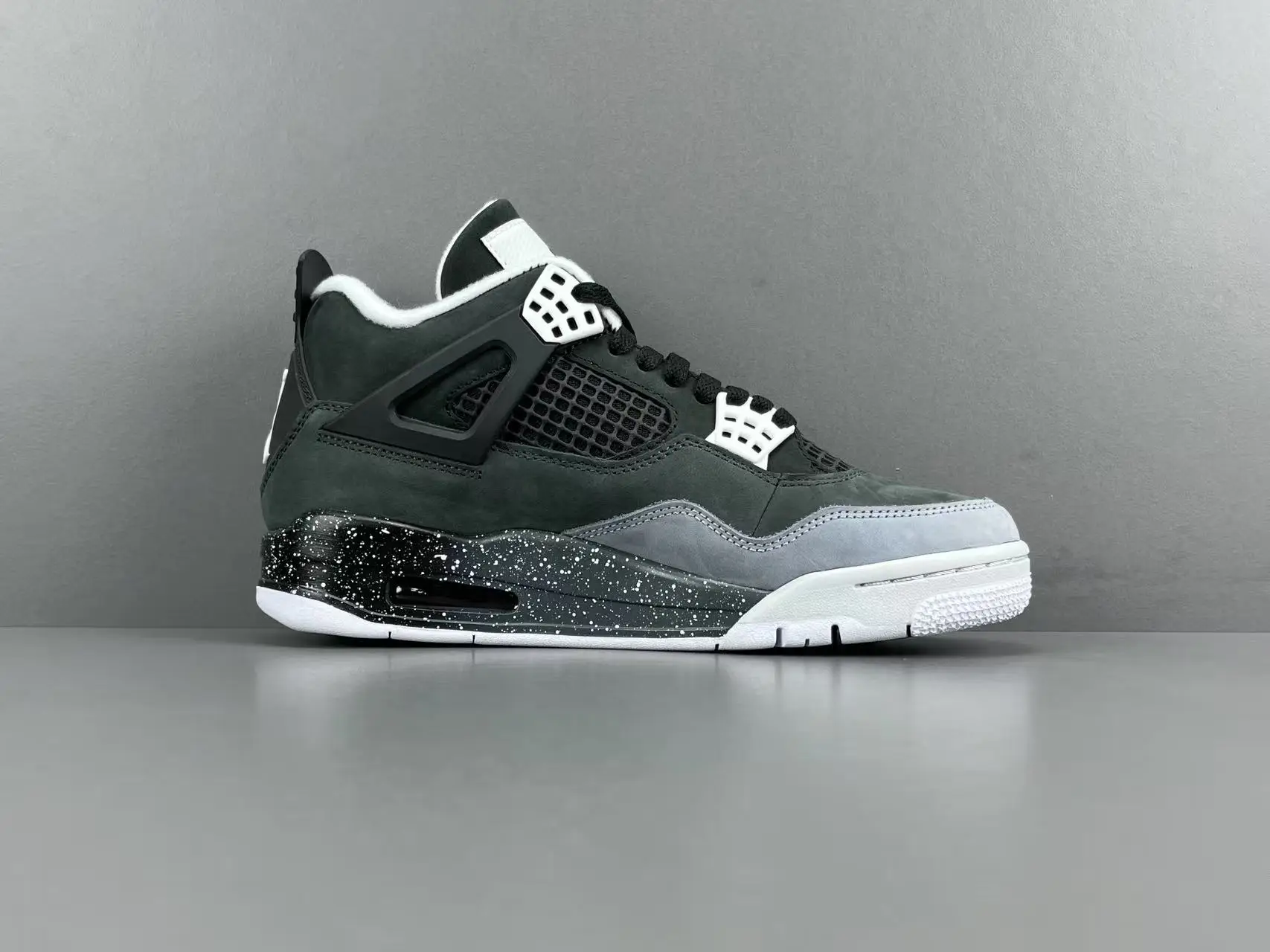 Air Jordan 4 Retro Black Canvas Grey leather sneakers with speckled black midsole and white outsole