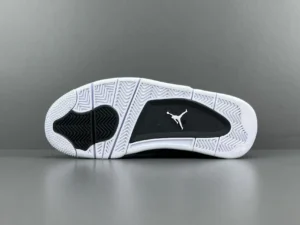 Nike Air Jordan 4 Retro black white rubber sole sneakers with Jumpman logo outsole traction pattern