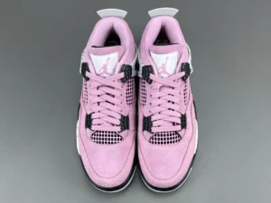 Nike Air Jordan 4 Retro Pink Suede sneakers with black accents and white mesh detailing